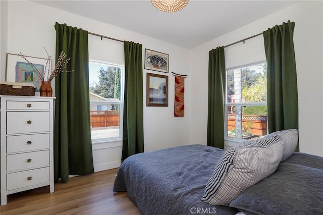 bedroom with wood finished floors