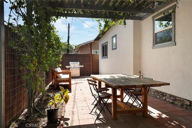 view of patio / terrace with outdoor dining space and fence