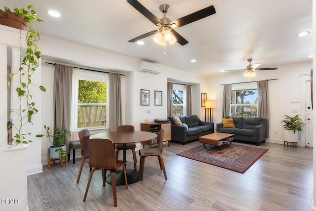 dining area with a healthy amount of sunlight and wood finished floors