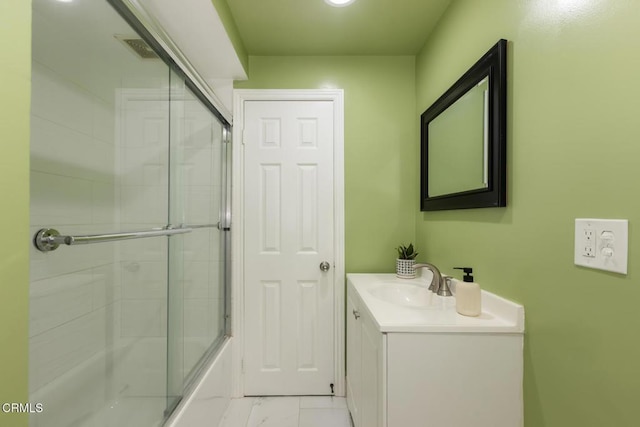 full bath with marble finish floor, visible vents, combined bath / shower with glass door, and vanity