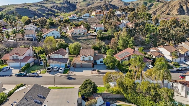 drone / aerial view with a residential view and a mountain view