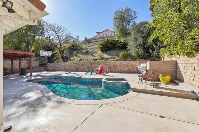 view of swimming pool featuring a patio area, fence, and a fenced in pool