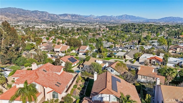 birds eye view of property with a residential view and a mountain view