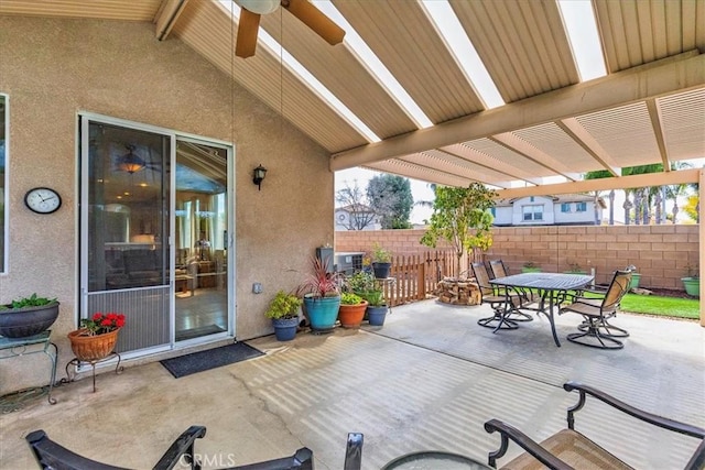 view of patio / terrace featuring ceiling fan, outdoor dining area, fence, and a pergola