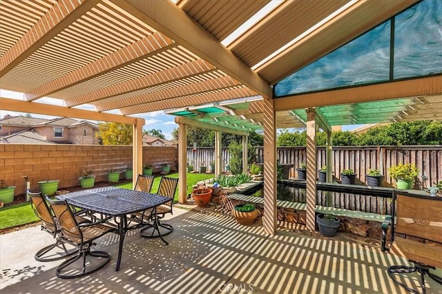 view of patio / terrace featuring a fenced backyard, outdoor dining area, and a pergola