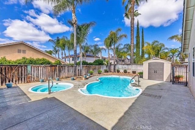 view of pool with a fenced in pool, a patio, a fenced backyard, a storage unit, and an outdoor structure