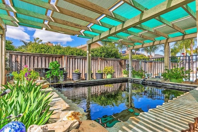 view of pool with a fenced backyard and a pergola