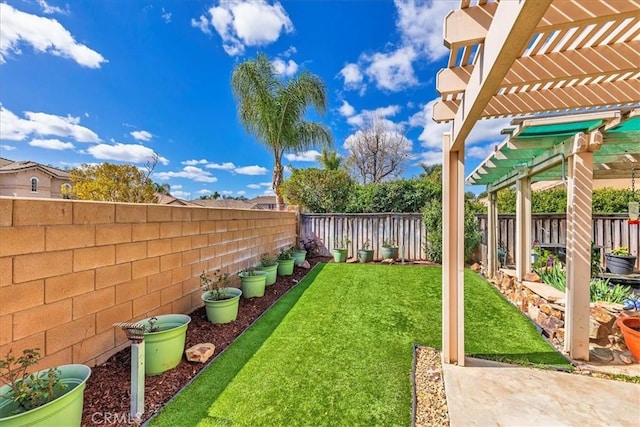 view of yard with a fenced backyard and a pergola