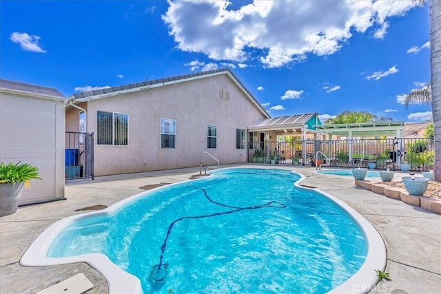 view of pool featuring a patio, fence, and a fenced in pool