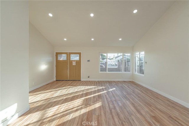 entrance foyer with light wood-style floors, baseboards, and recessed lighting