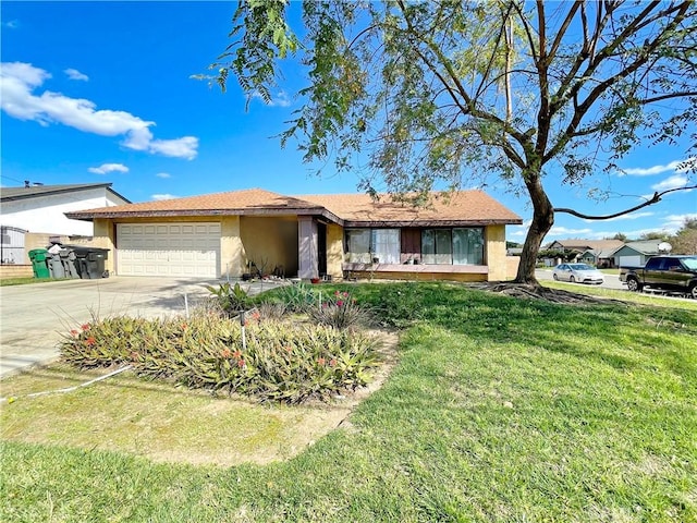 ranch-style house with an attached garage, a front lawn, concrete driveway, and stucco siding