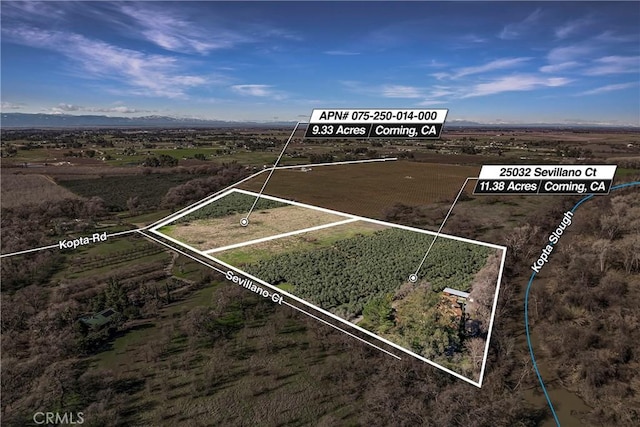 birds eye view of property featuring a rural view