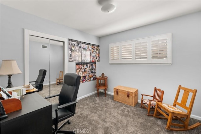 carpeted office space with visible vents and baseboards