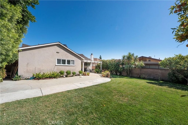 view of yard with a patio area and fence