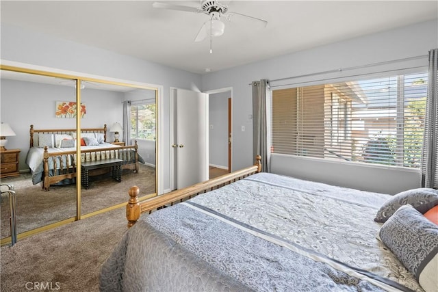 bedroom with a ceiling fan, a closet, and carpet flooring