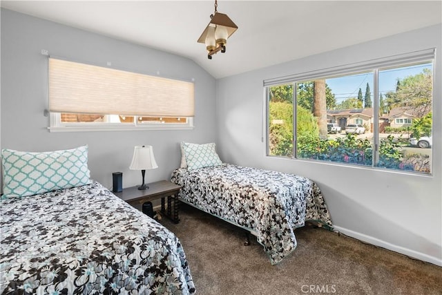 bedroom featuring carpet floors, vaulted ceiling, and baseboards