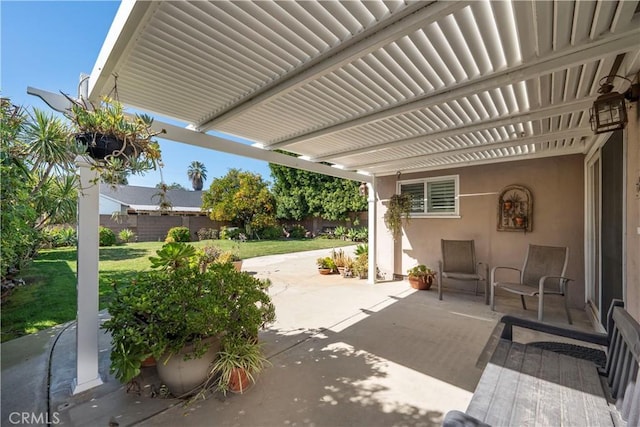 view of patio / terrace featuring fence