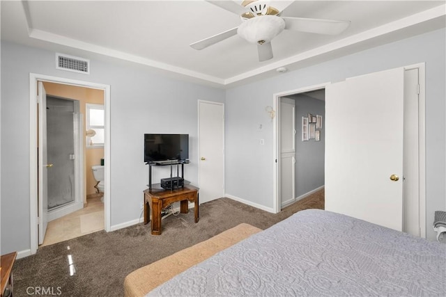 bedroom with carpet, baseboards, visible vents, and a tray ceiling