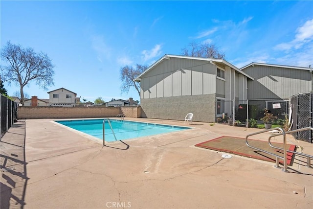 view of pool with a patio, fence, and a fenced in pool