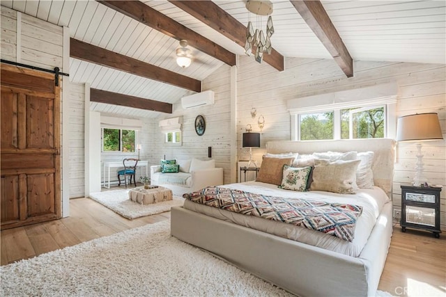 bedroom with vaulted ceiling with beams, a barn door, wooden walls, and a wall mounted air conditioner