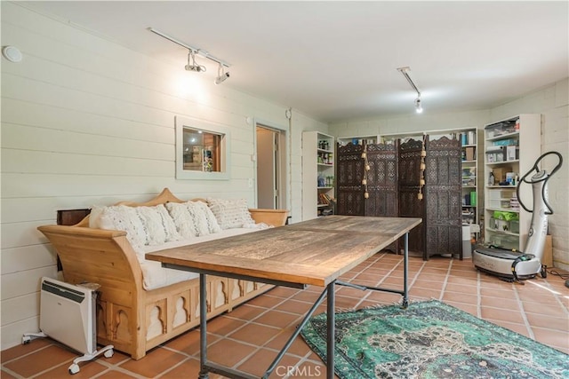 interior space with tile patterned floors and track lighting