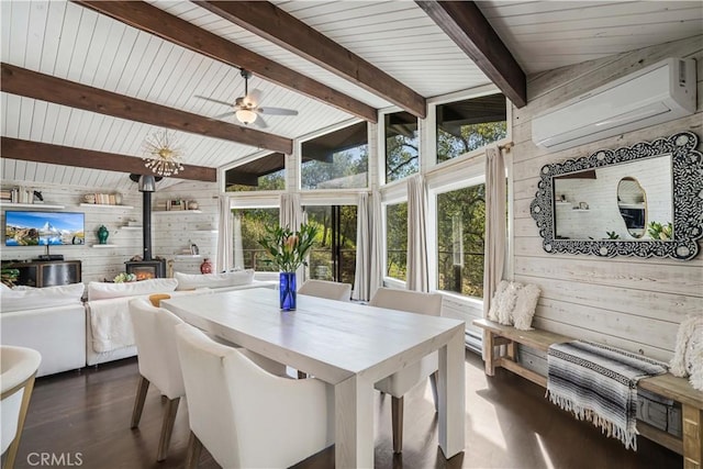 sunroom with lofted ceiling with beams, wooden ceiling, a ceiling fan, a wall mounted AC, and a wood stove