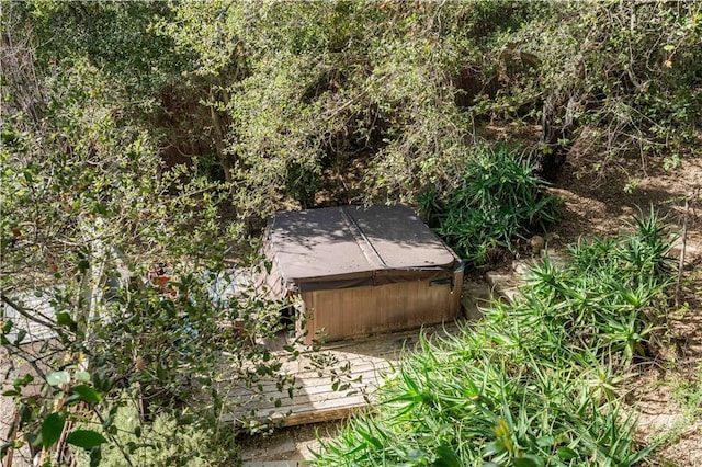 exterior space featuring a hot tub