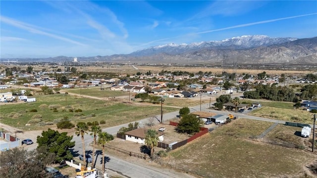 birds eye view of property with a mountain view