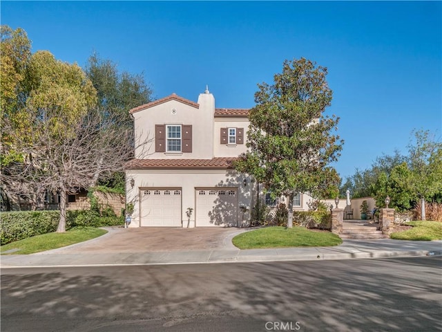 mediterranean / spanish-style house featuring a garage, concrete driveway, a chimney, a tiled roof, and stucco siding