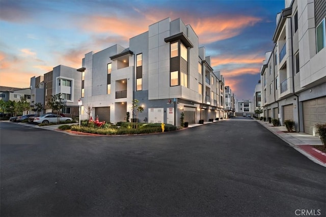 view of street featuring a residential view and curbs