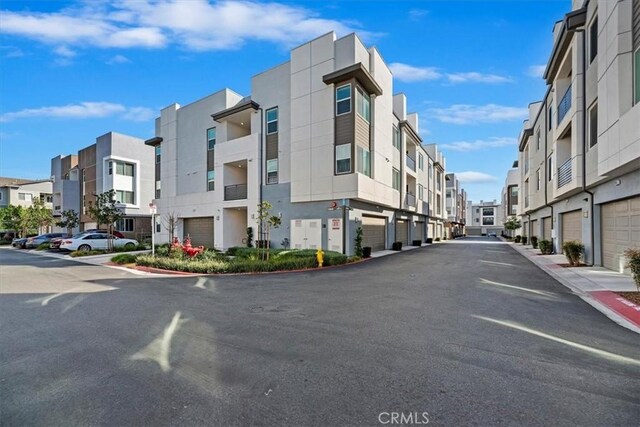 view of street with a residential view and curbs