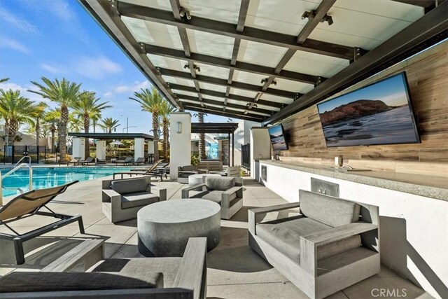 view of patio / terrace featuring outdoor lounge area and a community pool