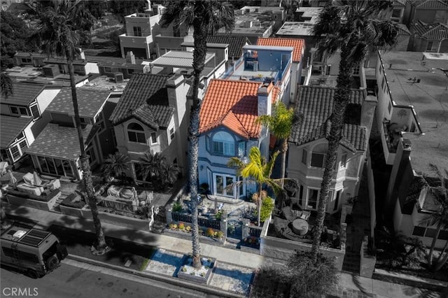 birds eye view of property with a residential view