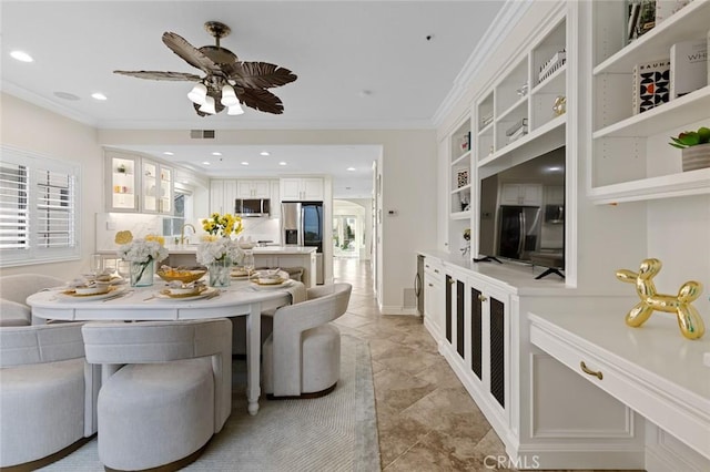 dining space with visible vents, built in shelves, crown molding, ceiling fan, and recessed lighting