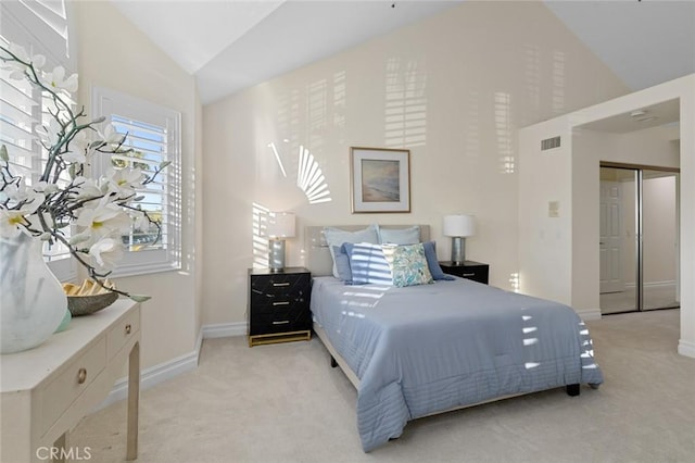 carpeted bedroom with baseboards, visible vents, and high vaulted ceiling