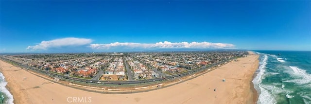 bird's eye view featuring a view of the beach and a water view