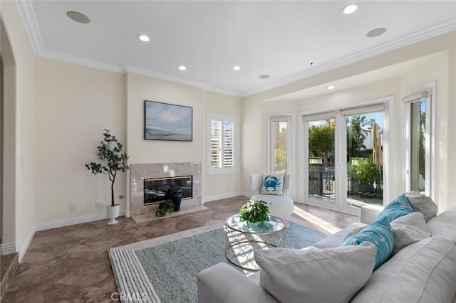 living area featuring crown molding, a fireplace, baseboards, and recessed lighting