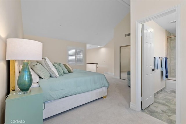 carpeted bedroom with ensuite bath, vaulted ceiling, baseboards, and visible vents