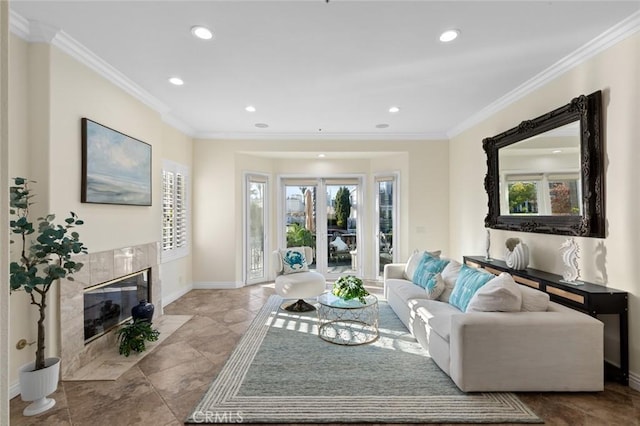 living room featuring crown molding, baseboards, recessed lighting, and a fireplace