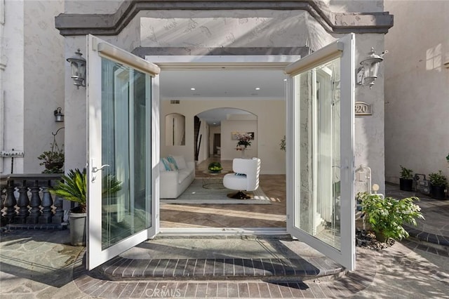 property entrance with stucco siding