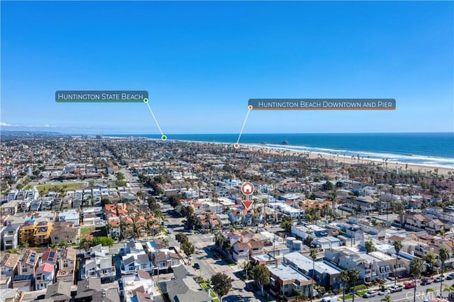 aerial view featuring a water view and a beach view