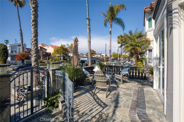 view of patio / terrace featuring a residential view and a balcony