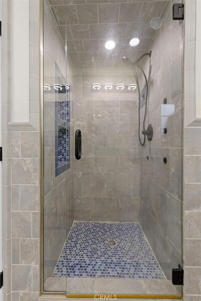 bathroom with a shower stall