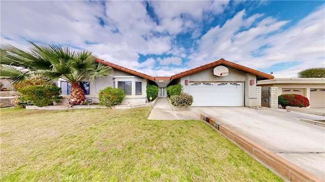 view of front facade featuring stucco siding, driveway, a tile roof, a front yard, and an attached garage