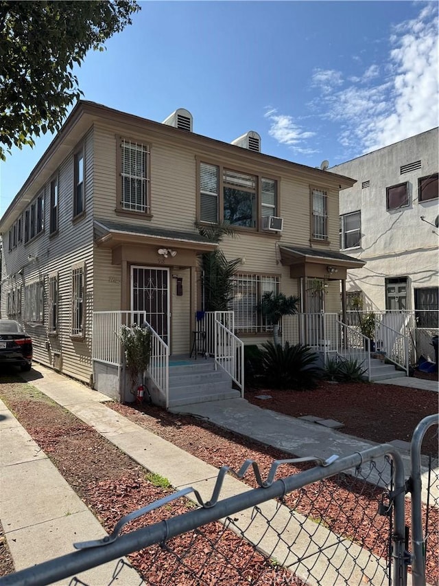 multi unit property with a porch and cooling unit