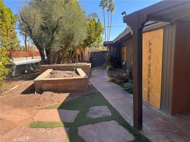 view of yard with a gate and fence