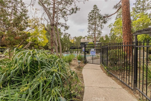 view of gate with fence