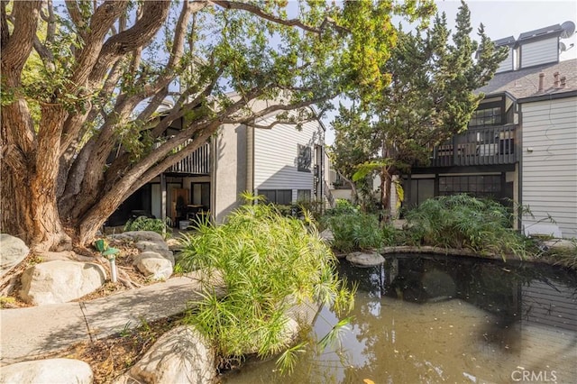 view of yard with a small pond