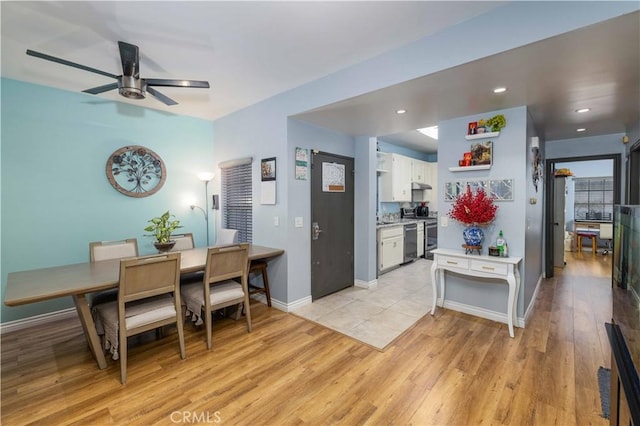 dining space featuring light wood-type flooring, baseboards, a ceiling fan, and recessed lighting