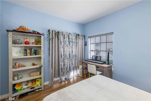 bedroom with wood finished floors